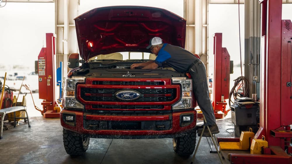Certified Ford technician servicing a Ford truck at Rogers Ford in Midland, TX