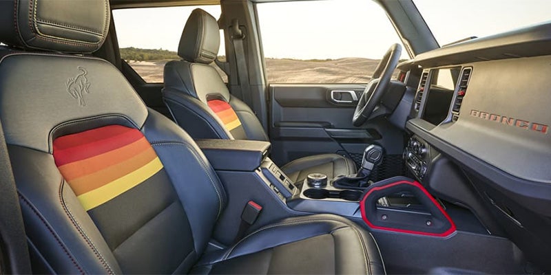 2025 Ford Bronco interior featuring SYNC 4 and rugged seating