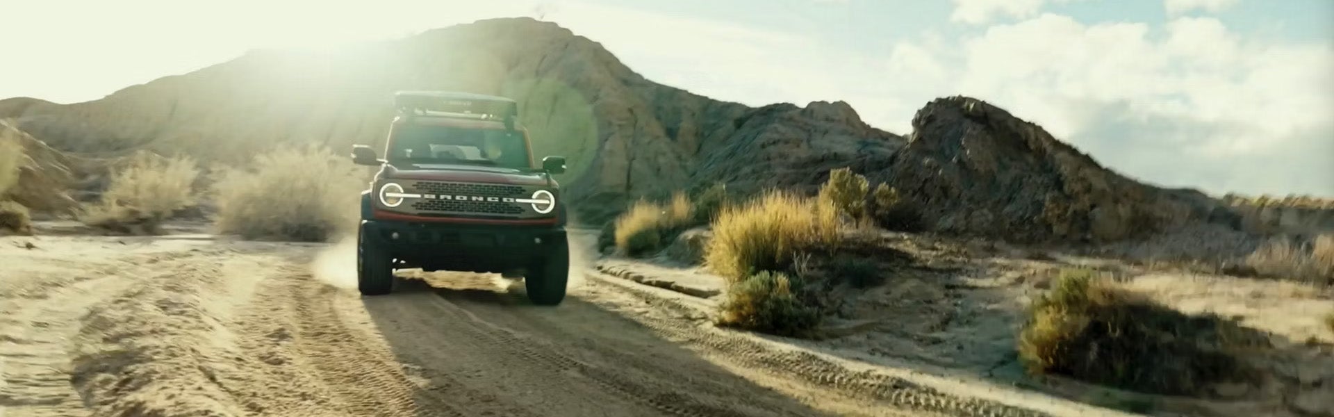 2026 Ford Bronco driving on a West Texas dirt road